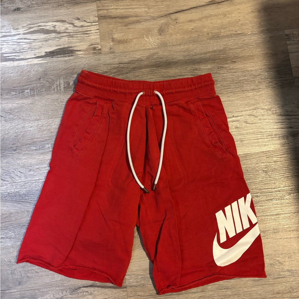 Nike Red Athletic Shorts with Vibrant Swoosh